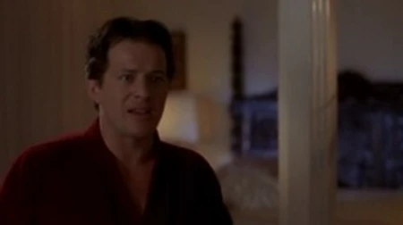 angie everhart wearing a black tanktop as guy runs his hands over her breasts and then kisses during very sex scene. from the deal
