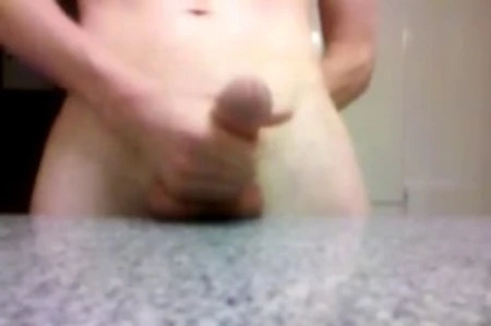 jack teased himself for 45 minutes so that his cumshot really flies out. as he's stroking cock he is busting balls a little as well against the counter.