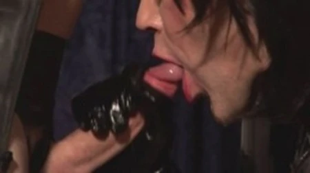 person in leather dominating submissive individuals