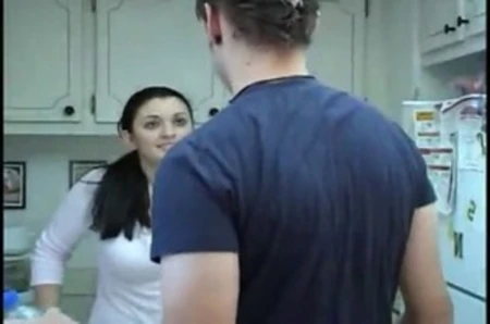 young girl serves a man in a domestic, playful scene