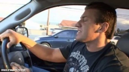 man driving with sexy cougars logo