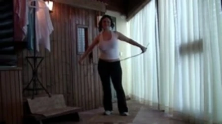 busty young woman jumping rope topless