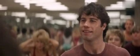 enter the world of exercise and health, where men women strain sweat to reach perfection. john travolta stars as reporter looking for inside story on.
