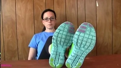 penny teasing her nike frees, and slowly taking them off.
